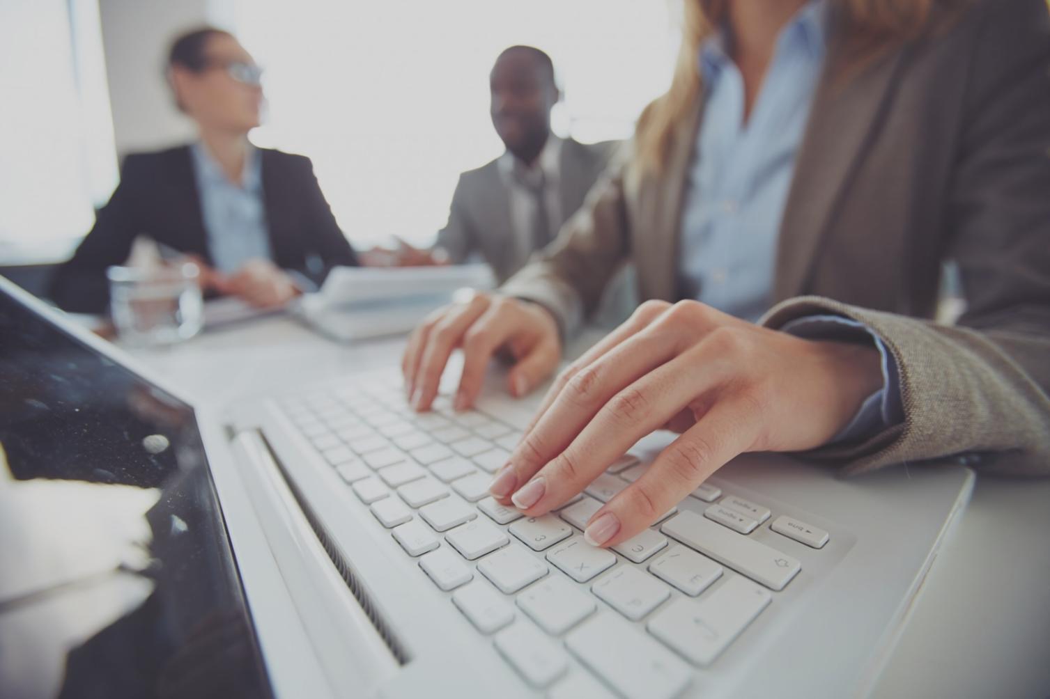 Modern office workspace with approval workflow displays